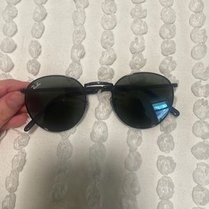 Brand new, round black Ray Bans. Green, mirror blue lens